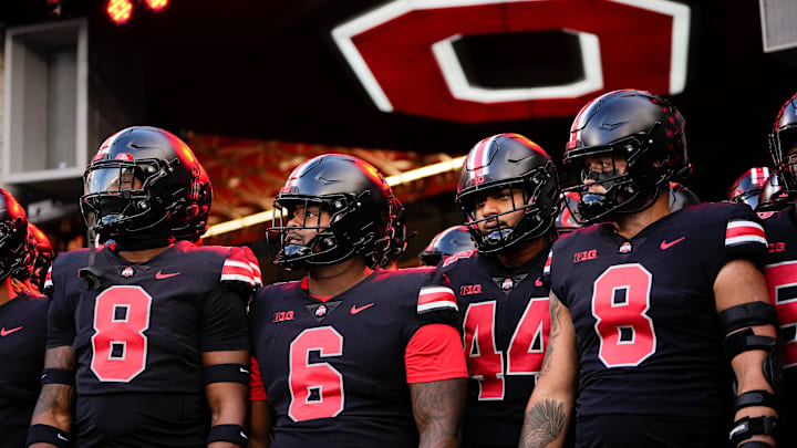 Sep 24, 2022; Columbus, Ohio, USA; Wearing black uniforms, the Ohio State Buckeyes prepare to take the field for warm-ups prior to the NCAA Division I football game against the Wisconsin Badgers at Ohio Stadium. Mandatory Credit: Adam Cairns-The Columbus Dispatch

Ncaa Football Wisconsin Badgers At Ohio State Buckeyes