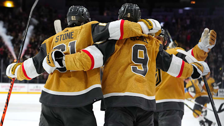 Dec 12, 2023; Las Vegas, Nevada, USA; Vegas Golden Knights right wing Mark Stone (61) celebrates with Vegas Golden Knights center Jack Eichel (9) after scoring a goal against the Calgary Flames in an overtime period to give the Golden Knights a 5-4 victory at T-Mobile Arena. Mandatory Credit: Stephen R. Sylvanie-Imagn Images