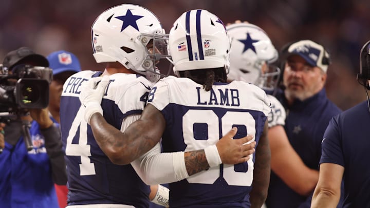 Dallas Cowboys wide receiver CeeDee Lamb and quarterback Dak Prescott talk during the game against the Washington Commanders.