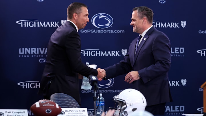 Dec 8, 2025; University Park, PA, USA; Matt Campbell, left, shakes hands with Penn State University athletic director Pat Kraft, right, while being announced as the Penn State Nittany Lions new head coach during a press conference at the Beaver Stadium Press Room. Mandatory Credit: Matthew O'Haren-Imagn Images Dec 8, 2025; University Park, PA, USA; Matt Campbell, left, shakes hands with Penn State University athletic director Pat Kraft, right, while being announced as the Penn State Nittany Lions new head coach during a press conference at the Beaver Stadium Press Room. Mandatory Credit: Matthew O'Haren-Imagn Images