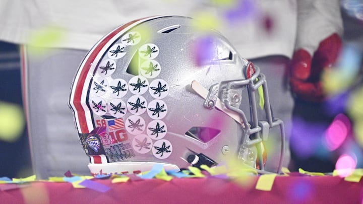 Jan 10, 2025; Arlington, TX, USA; A view of an Ohio State Buckeyes helmet and confetti after the Buckeyes defeat the Texas Longhorns at AT&T Stadium. Mandatory Credit: Jerome Miron-Imagn Images Jan 10, 2025; Arlington, TX, USA; A view of an Ohio State Buckeyes helmet and confetti after the Buckeyes defeat the Texas Longhorns at AT&T Stadium. Mandatory Credit: Jerome Miron-Imagn Images