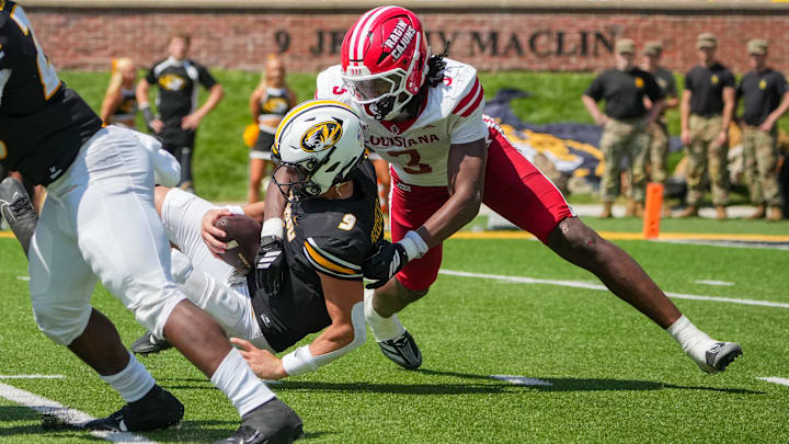 Missouri Tigers quarterback Beau Pribula and Louisiana-Lafayette Ragin Cajuns linebacker Jaden Dugger.