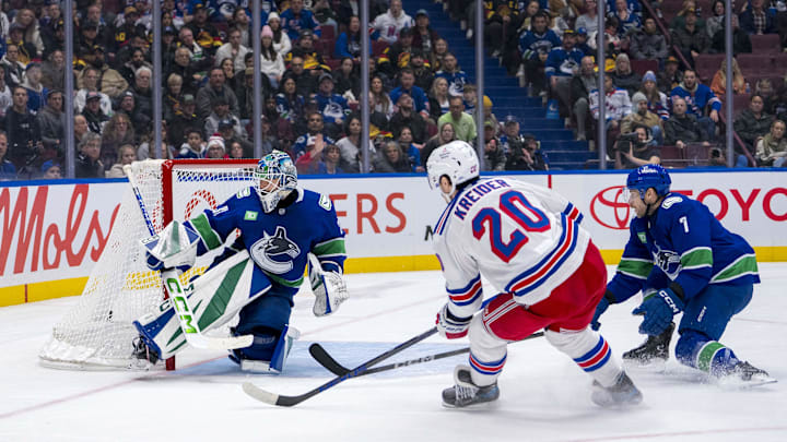 Nov 19, 2024; Vancouver, British Columbia, CAN; Vancouver Canucks defenseman Carson Soucy (7) watches as New York Rangers forward Chris Kreider (20) scores on goalie Arturs Silovs (31) during the third period at Rogers Arena. Mandatory Credit: Bob Frid-Imagn Images