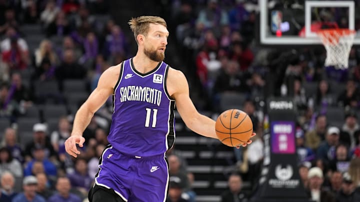 Nov 24, 2024; Sacramento, California, USA; Sacramento Kings forward Domantas Sabonis (11) dribbles against the Brooklyn Nets during the third quarter at Golden 1 Center. Mandatory Credit: Darren Yamashita-Imagn Images