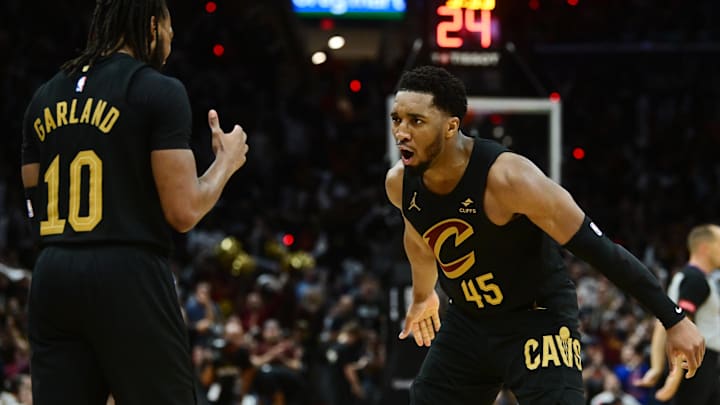 May 5, 2024; Cleveland, Ohio, USA; Cleveland Cavaliers guard Donovan Mitchell (45) celebrates with guard Darius Garland (10) after Garland hit a three point basket during the second half against the Orlando Magic in game seven of the first round for the 2024 NBA playoffs at Rocket Mortgage FieldHouse. Mandatory Credit: Ken Blaze-Imagn Images