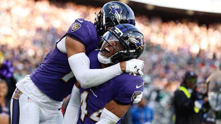 Nov 23, 2025; Baltimore, Maryland, USA; Baltimore Ravens cornerback Marlon Humphrey (44) celebrates with Baltimore Ravens safety Kyle Hamilton (14) after forcing a fumble during the fourth quarter against the New York Jets at M&T Bank Stadium. Mandatory Credit: Peter Casey-Imagn Images