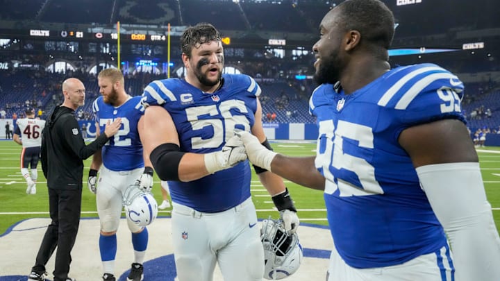 Indianapolis Colts guard Quenton Nelson (56) and Indianapolis Colts defensive tackle Adetomiwa Adebawore (95) celebrate Sunday, Sept. 22, 2024, after a game against the Chicago Bears at Lucas Oil Stadium in Indianapolis.