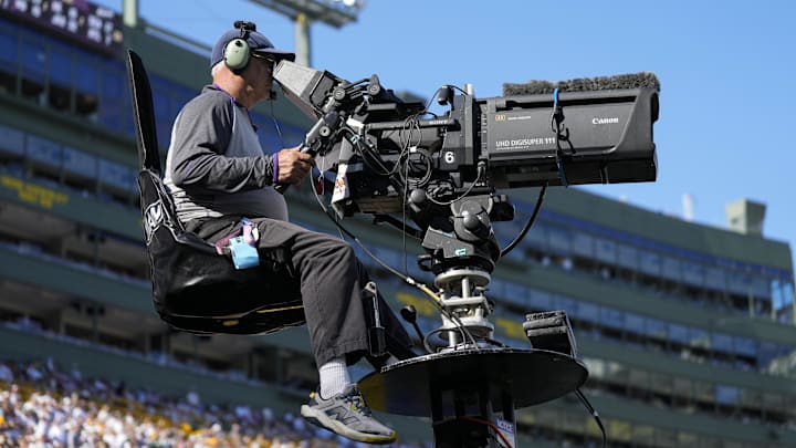 Oct 20, 2024; Green Bay, Wisconsin, USA;  General view of a television camera operator during the game between the Houston Texans and Green Bay Packers at Lambeau Field. Mandatory Credit: Jeff Hanisch-Imagn Images