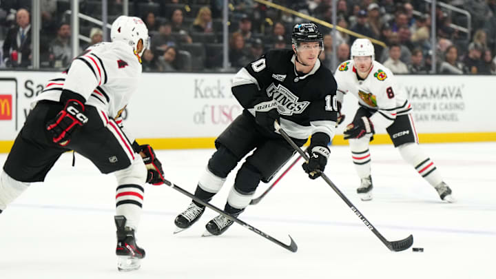 Nov 2, 2024; Los Angeles, California, USA; LA Kings left wing Tanner Jeannot (10) skates with the puck against the Chicago Blackhawks in the second period at Crypto.com Arena. Mandatory Credit: Kirby Lee-Imagn Images