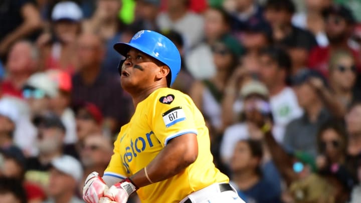 Boston Red Sox third baseman Rafael Devers (11) hits a home run during the fifth inning against the Kansas City Royals at Fenway Park on July 13.