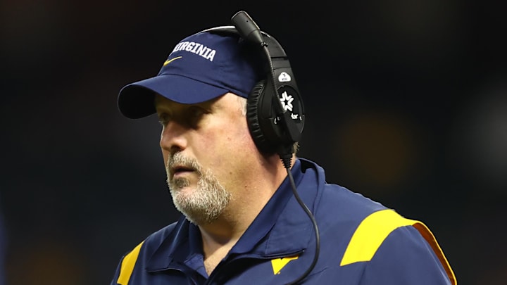 Dec 28, 2021; Phoenix, AZ, USA; West Virginia Mountaineers offensive line coach Matt Moore against the Minnesota Golden Gophers in the Guaranteed Rate Bowl at Chase Field. Mandatory Credit: Mark J. Rebilas-Imagn Images