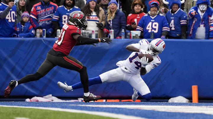 Nov 16, 2025; Orchard Park, New York, USA;  Buffalo Bills wide receiver Tyrell Shavers (14) makes a touchdown catch against Tampa Bay Buccaneers cornerback Benjamin Morrison (21)