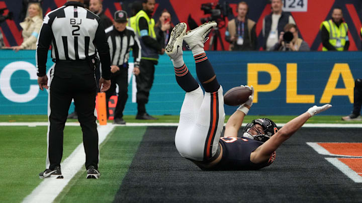 Oct 13, 2024; London, United Kingdom; Chicago Bears tight end Cole Kmet (85) celebrates after scoring on a 31-yard touchdown reception against the Jacksonville Jaguars in the first half during an NFL International Series game at Tottenham Hotspur Stadium. Mandatory Credit: Kirby Lee-Imagn Images