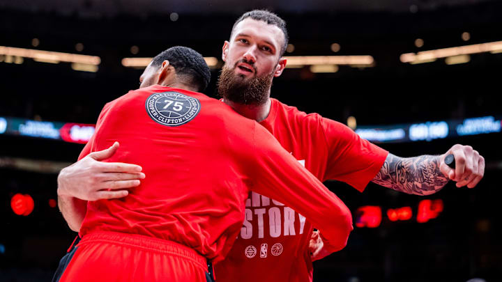 Feb 8, 2026; Toronto, Ontario, CAN;  Toronto Raptors forward Sandro Mamukelashvili (54) hugs guard Garrett Temple (17) before playing the Indiana Pacers at Scotiabank Arena. Mandatory Credit: Kevin Sousa-Imagn Images