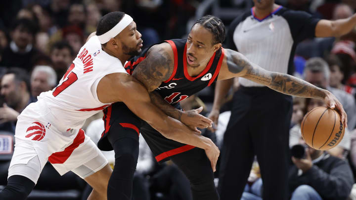 Jan 30, 2024; Chicago, Illinois, USA; Toronto Raptors forward Bruce Brown (11) defends against Chicago Bulls forward DeMar DeRozan (11) during the first half at United Center. Mandatory Credit: Kamil Krzaczynski-USA TODAY Sports