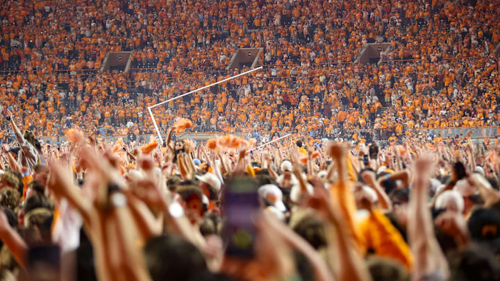 Oct 19, 2024; Knoxville, Tennessee, USA; Tennessee Volunteers fans tear down the goal posts after a victory over the Alabama Crimson Tide and at Neyland Stadium. Mandatory Credit: Randy Sartin-Imagn Images