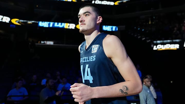 Grizzlies' Zach Edey (14) runs on the court as he is introduced