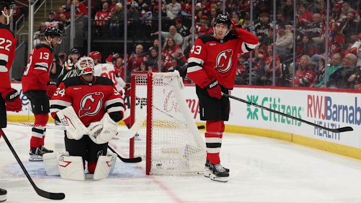 Jan 4, 2026; Newark, New Jersey, USA; New Jersey Devils goaltender Jake Allen (34) and New Jersey Devils defenseman Luke Hughes (43) react after Hughes scored in his own goal during the first period at Prudential Center. Carolina Hurricanes left wing Nikolaj Ehlers (27) (not shown) was credited with the goal. Mandatory Credit: Ed Mulholland-Imagn Images