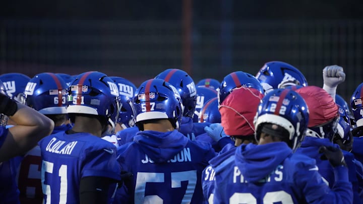 Nov 8, 2024; Munich, Germany; New York Giants players huddle during practice at the FC Bayern Munchen training grounds at Sabener Strasse.   