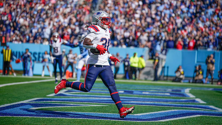 New England Patriots running back Rhamondre Stevenson (38) runs in a touchdown against the Tennessee Titans during the third quarter at Nissan Stadium in Nashville, Tenn., Sunday, Oct. 19, 2025.