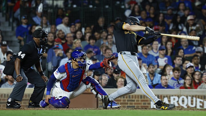 Pittsburgh Pirates outfielder Bryan Reynolds (10) hits a three-run home run against the Chicago Cubs during the eighth inning at Wrigley Field.