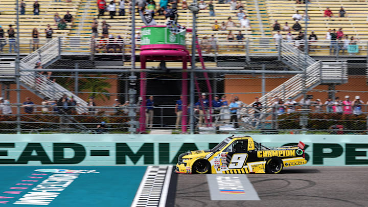 Oct 26, 2024; Homestead, Florida, USA; Craftsman Truck Series driver Grant Enfinger (9) crosses the start/finish line to win the Baptist Health 200 at Homestead-Miami Speedway. Oct 26, 2024; Homestead, Florida, USA; Craftsman Truck Series driver Grant Enfinger (9) crosses the start/finish line to win the Baptist Health 200 at Homestead-Miami Speedway.