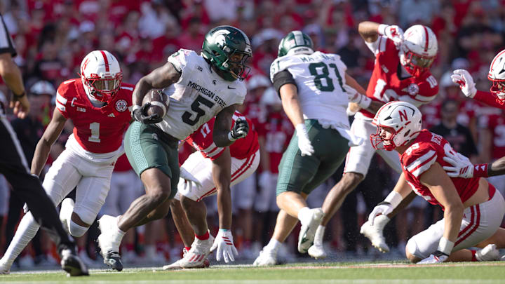 Oct 4, 2025; Lincoln, Nebraska, USA; Nebraska Cornhuskers defensive back Ceyair Wright (1) attempts to tackle Michigan State Spartans running back Makhi Frazier (5) during the second quarter of the game at Memorial Stadium. Mandatory Credit: Kylie Graham-Imagn Images Oct 4, 2025; Lincoln, Nebraska, USA; Nebraska Cornhuskers defensive back Ceyair Wright (1) attempts to tackle Michigan State Spartans running back Makhi Frazier (5) during the second quarter of the game at Memorial Stadium. Mandatory Credit: Kylie Graham-Imagn Images