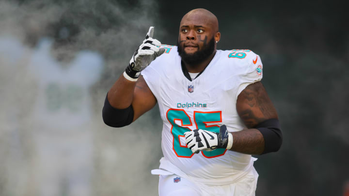 Guard Robert Jones enters the field to take on the New York Jets at Hard Rock Stadium in 2023.