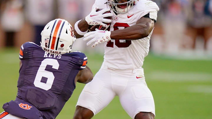 Nov 25, 2023; Auburn, Alabama, USA; Alabama Crimson Tide wide receiver Kendrick Law (19) fights for