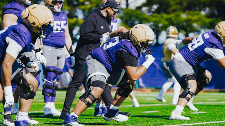 Champ Taulealea comes out of a stance during Husky spring ball. Champ Taulealea comes out of a stance during Husky spring ball.
