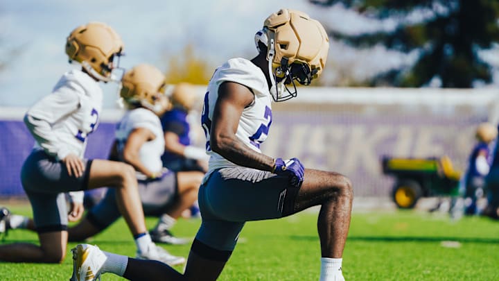 D'Aryhian Clemons stretches out during a 2025 UW spring practice. D'Aryhian Clemons stretches out during a 2025 UW spring practice.