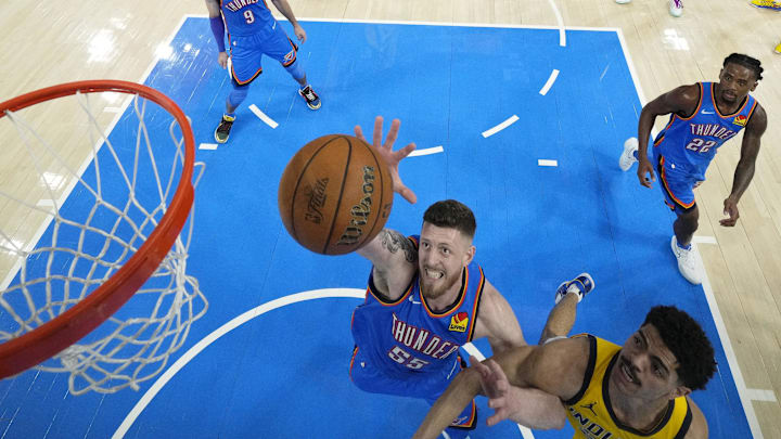 Jun 22, 2025; Oklahoma City, Oklahoma, USA; Oklahoma City Thunder center Isaiah Hartenstein (55) reaches for the ball against Indiana Pacers guard Ben Sheppard (26) during the second half of game seven of the 2025 NBA Finals at Paycom Center. Mandatory Credit: Kyle Terada-Imagn Images Jun 22, 2025; Oklahoma City, Oklahoma, USA; Oklahoma City Thunder center Isaiah Hartenstein (55) reaches for the ball against Indiana Pacers guard Ben Sheppard (26) during the second half of game seven of the 2025 NBA Finals at Paycom Center. Mandatory Credit: Kyle Terada-Imagn Images