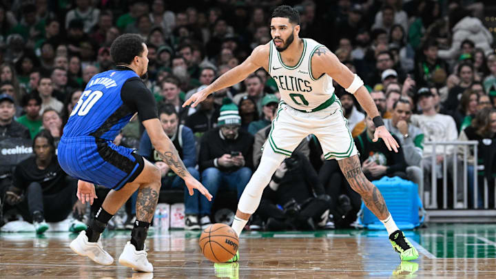 Boston Celtics forward Jayson Tatum (0) defends Orlando Magic guard Cole Anthony (50) during the second half at TD Garden.