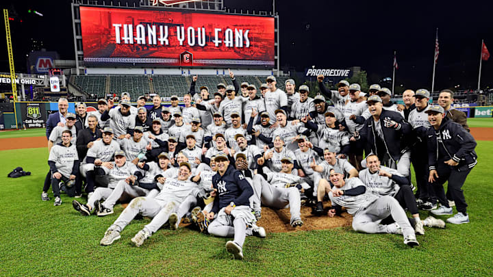 The Yankees pose after winning the 2024 American League pennant. The Yankees pose after winning the 2024 American League pennant.