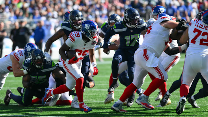 Oct 6, 2024; Seattle, Washington, USA; New York Giants running back Tyrone Tracy Jr. (29) carries the ball against the Seattle Seahawks during the first half at Lumen Field. Mandatory Credit: Steven Bisig-Imagn Images Oct 6, 2024; Seattle, Washington, USA; New York Giants running back Tyrone Tracy Jr. (29) carries the ball against the Seattle Seahawks during the first half at Lumen Field. Mandatory Credit: Steven Bisig-Imagn Images