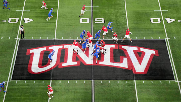A general overall view as UNLV Rebels quarterback Jayden Maiava (1) throws the ball on the UNLV logo at midfield against the Boise State Broncos in the first half during the Mountain West Championship at Allegiant Stadium. Mandatory Credit: Kirby Lee-Imagn Images A general overall view as UNLV Rebels quarterback Jayden Maiava (1) throws the ball on the UNLV logo at midfield against the Boise State Broncos in the first half during the Mountain West Championship at Allegiant Stadium. Mandatory Credit: Kirby Lee-Imagn Images