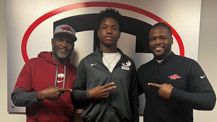 Theodore, Alabama 4-star linebacker Jaden Bush (center) with Arkansas Razorbacks co-defensive coordinator Marcus Woodson (left) and defensive coordinator Travis Williams (right) during a recruiting visit in January.