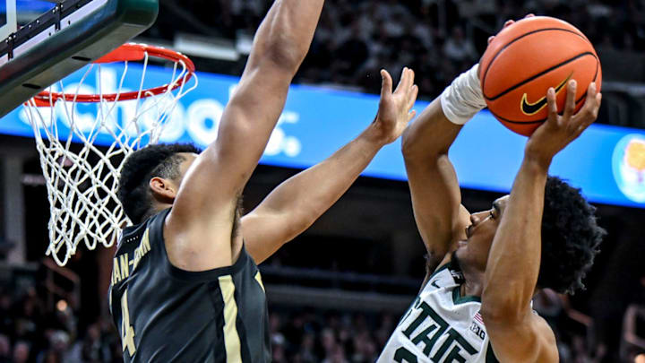 Michigan State's Jaden Akins, right, scores as Purdue's Trey Kaufman-Renn defends during the second half on Tuesday, Feb. 18, 2025, at the Breslin Center in East Lansing. Michigan State's Jaden Akins, right, scores as Purdue's Trey Kaufman-Renn defends during the second half on Tuesday, Feb. 18, 2025, at the Breslin Center in East Lansing.