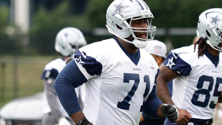 Dallas Cowboys OT Nathan Thomas goes through a drill during practice at the Ford Center at the Star Training Facility. Dallas Cowboys OT Nathan Thomas goes through a drill during practice at the Ford Center at the Star Training Facility.