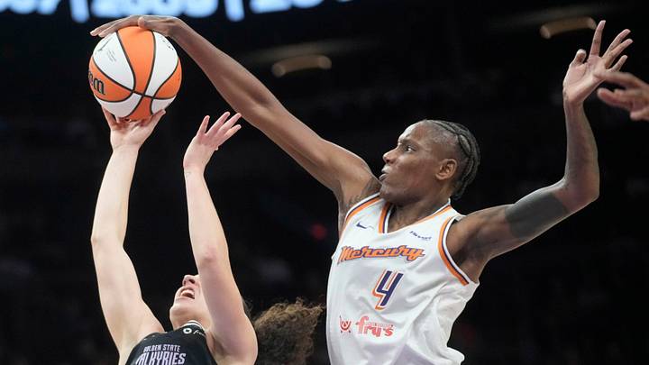 Phoenix Mercury forward Natasha Mack (4) blocks a shot by Golden State Valkyries guard Carla Leite (0) during pre-season action at PHX Arena May 11, 2025. Phoenix Mercury forward Natasha Mack (4) blocks a shot by Golden State Valkyries guard Carla Leite (0) during pre-season action at PHX Arena May 11, 2025.
