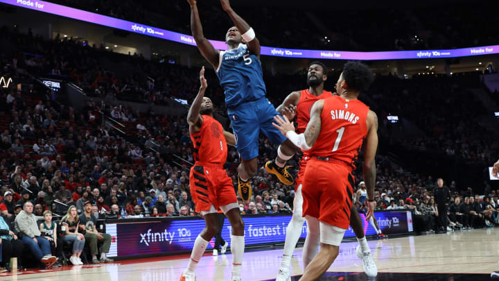 Feb 13, 2024; Portland, Oregon, USA; Minnesota Timberwolves guard Anthony Edwards (5) shoots the ball over Portland Trail Blazers forward Jerami Grant (9), center Deandre Ayton (2), and guard Anfernee Simons (1) in the second quarter at Moda Center. Mandatory Credit: Jaime Valdez-USA TODAY Sports Feb 13, 2024; Portland, Oregon, USA; Minnesota Timberwolves guard Anthony Edwards (5) shoots the ball over Portland Trail Blazers forward Jerami Grant (9), center Deandre Ayton (2), and guard Anfernee Simons (1) in the second quarter at Moda Center. Mandatory Credit: Jaime Valdez-USA TODAY Sports