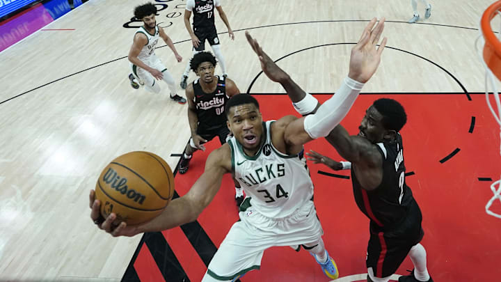 Jan 28, 2025; Portland, Oregon, USA; Milwaukee Bucks power forward Giannis Antetokounmpo (34) drives to the basket against Portland Trail Blazers center Deandre Ayton (2) during the second half at Moda Center. Mandatory Credit: Soobum Im-Imagn Images