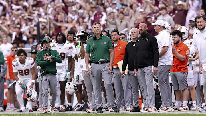Dec 20, 2025; College Station, TX, USA; Miami Hurricanes head coach Mario Cristobal reacts during the second half against the Texas A&M Aggies at Kyle Field. Mandatory Credit: Maria Lysaker-Imagn Images Dec 20, 2025; College Station, TX, USA; Miami Hurricanes head coach Mario Cristobal reacts during the second half against the Texas A&M Aggies at Kyle Field. Mandatory Credit: Maria Lysaker-Imagn Images