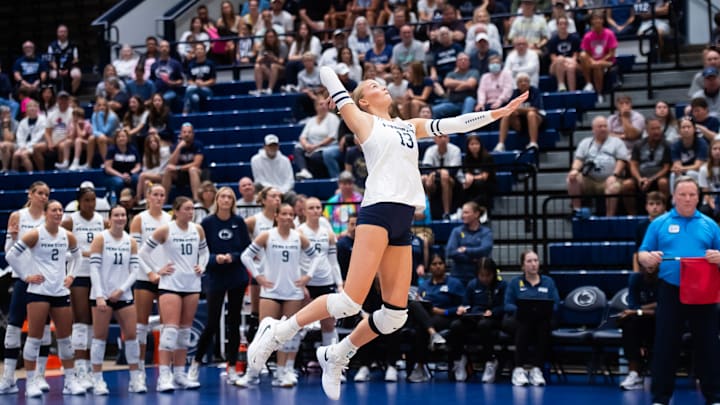 Penn State's Emmi Sellman (13) serves during a Big Ten volleyball match against UCLA