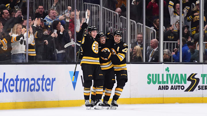 Oct 30, 2025; Boston, Massachusetts, USA; Boston Bruins center Marat Khusnutdinov (92) celebrates scoring an overtime goal with center Fraser Minten (93) and defenseman Hampus Lindholm (27) against the Buffalo Sabres at TD Garden. Mandatory Credit: Bob DeChiara-Imagn Images