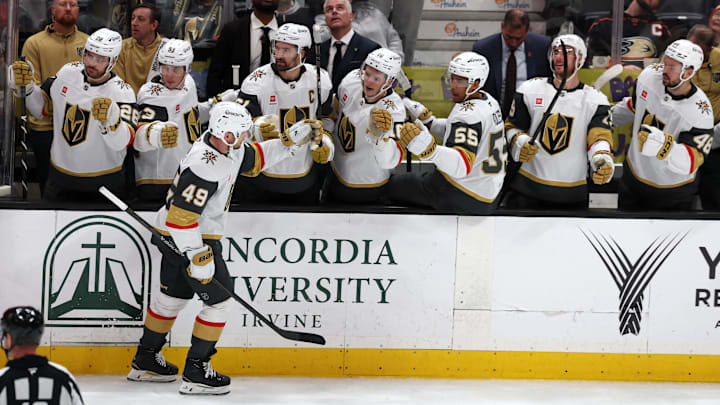 Feb 1, 2026; Anaheim, California, USA;  Vegas Golden Knights left wing Ivan Barbashev (49) celebrates with teammates after scoring a goal during the third period against the Anaheim Ducks at Honda Center. Mandatory Credit: Kiyoshi Mio-Imagn Images