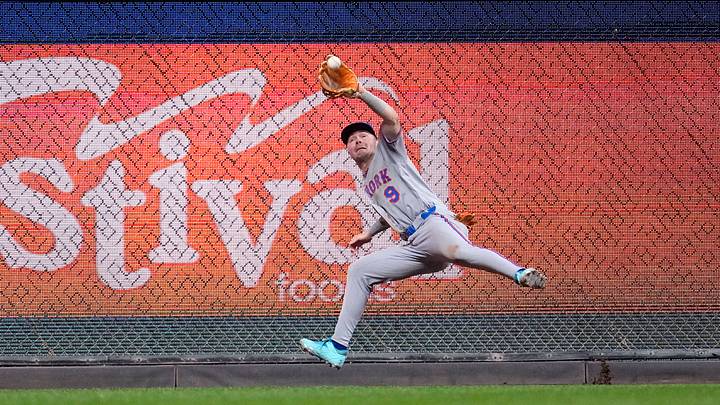 Jul 21, 2026; Milwaukee, Wisconsin, USA; New York Mets outfielder A.J. Ewing (9) catches a fly ball against the Milwaukee Brewers in the sixth inning at American Family Field. Mandatory Credit: Michael McLoone-Imagn Images