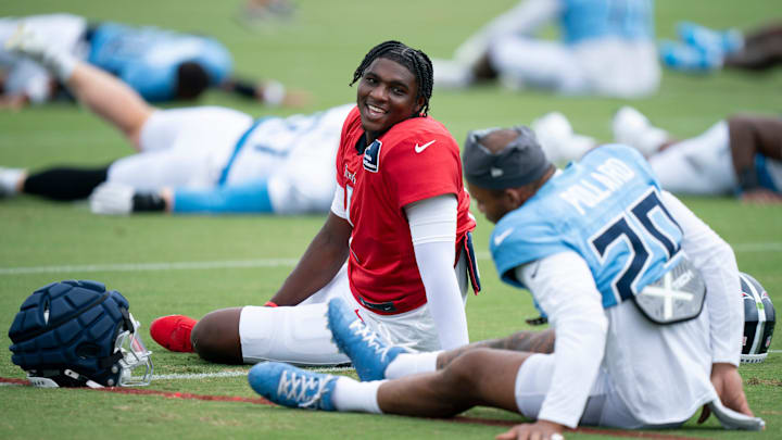 Tennessee Titans quarterback Cam Ward (1) and running back Tony Pollard (20) go through stretches during Day 6 of training camp at Ascension Saint Thomas Sports Park in Nashville, Tenn., Friday, Aug. 1, 2025. Tennessee Titans quarterback Cam Ward (1) and running back Tony Pollard (20) go through stretches during Day 6 of training camp at Ascension Saint Thomas Sports Park in Nashville, Tenn., Friday, Aug. 1, 2025.