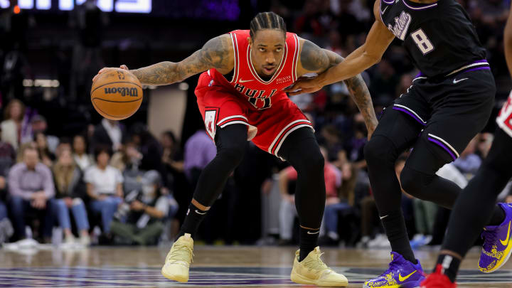 Mar 14, 2022; Sacramento, California, USA; Chicago Bulls forward DeMar DeRozan (11) controls the ball against Sacramento Kings forward Maurice Harkless (8) during the third quarter at Golden 1 Center. 