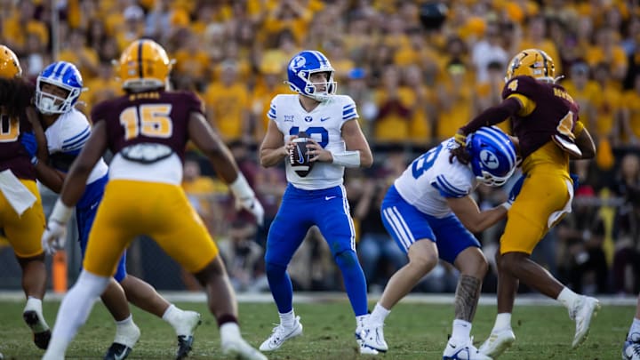 Nov 23, 2024; Tempe, Arizona, USA; Brigham Young Cougars quarterback Jake Retzlaff (12) against the Arizona State Sun Devils at Mountain America Stadium. Mandatory Credit: Mark J. Rebilas-Imagn Images Nov 23, 2024; Tempe, Arizona, USA; Brigham Young Cougars quarterback Jake Retzlaff (12) against the Arizona State Sun Devils at Mountain America Stadium. Mandatory Credit: Mark J. Rebilas-Imagn Images